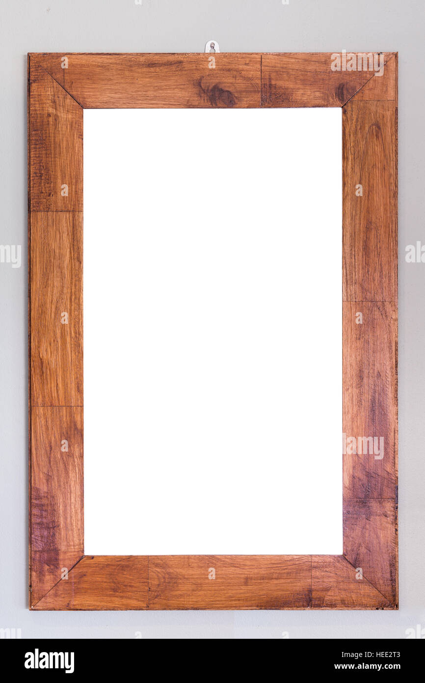 Empty wooden photo frame hanging on the wall. Interior decoration Stock ...