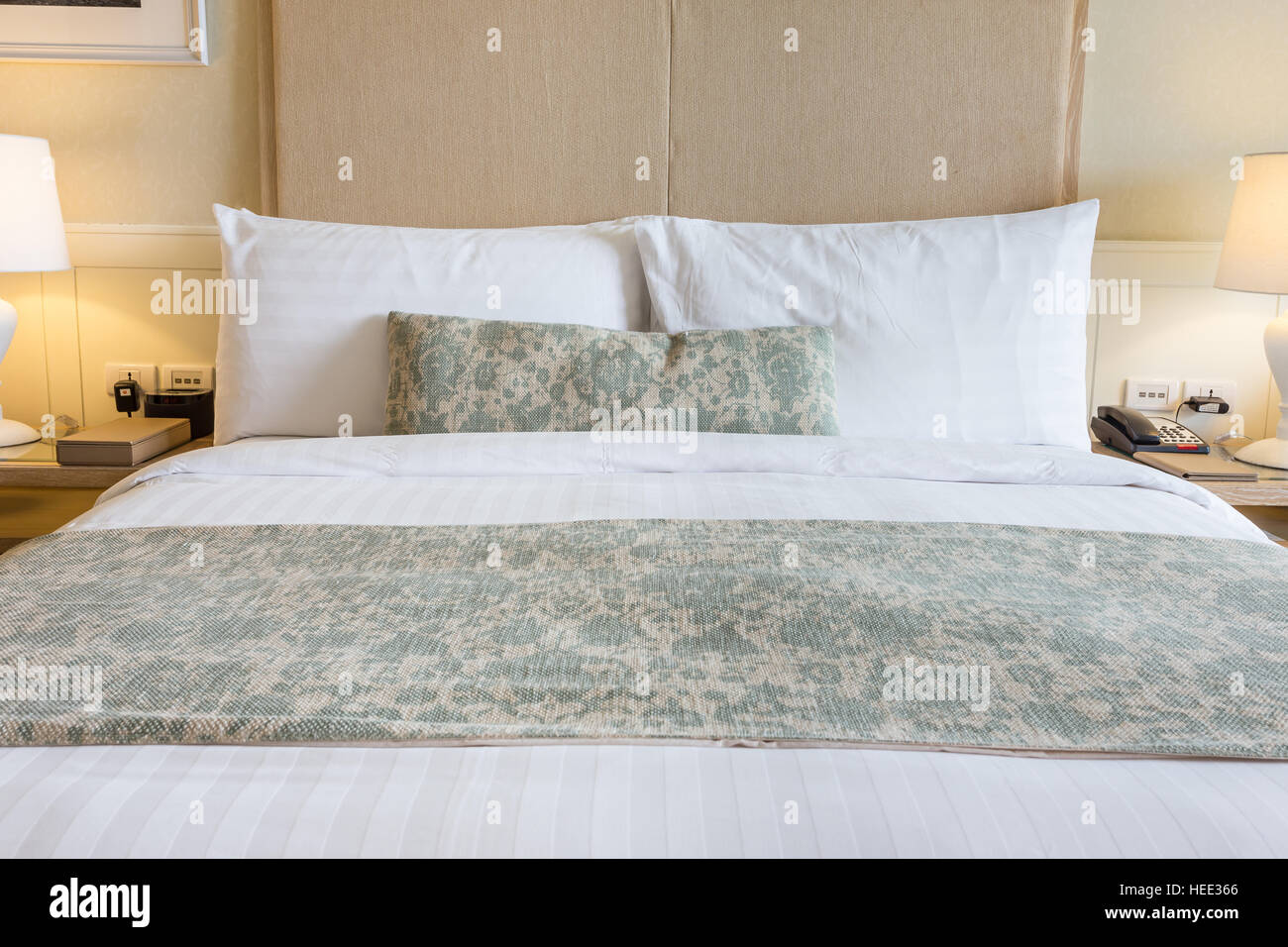 Close up white bedding sheets and pillow in hotel room Stock Photo Alamy