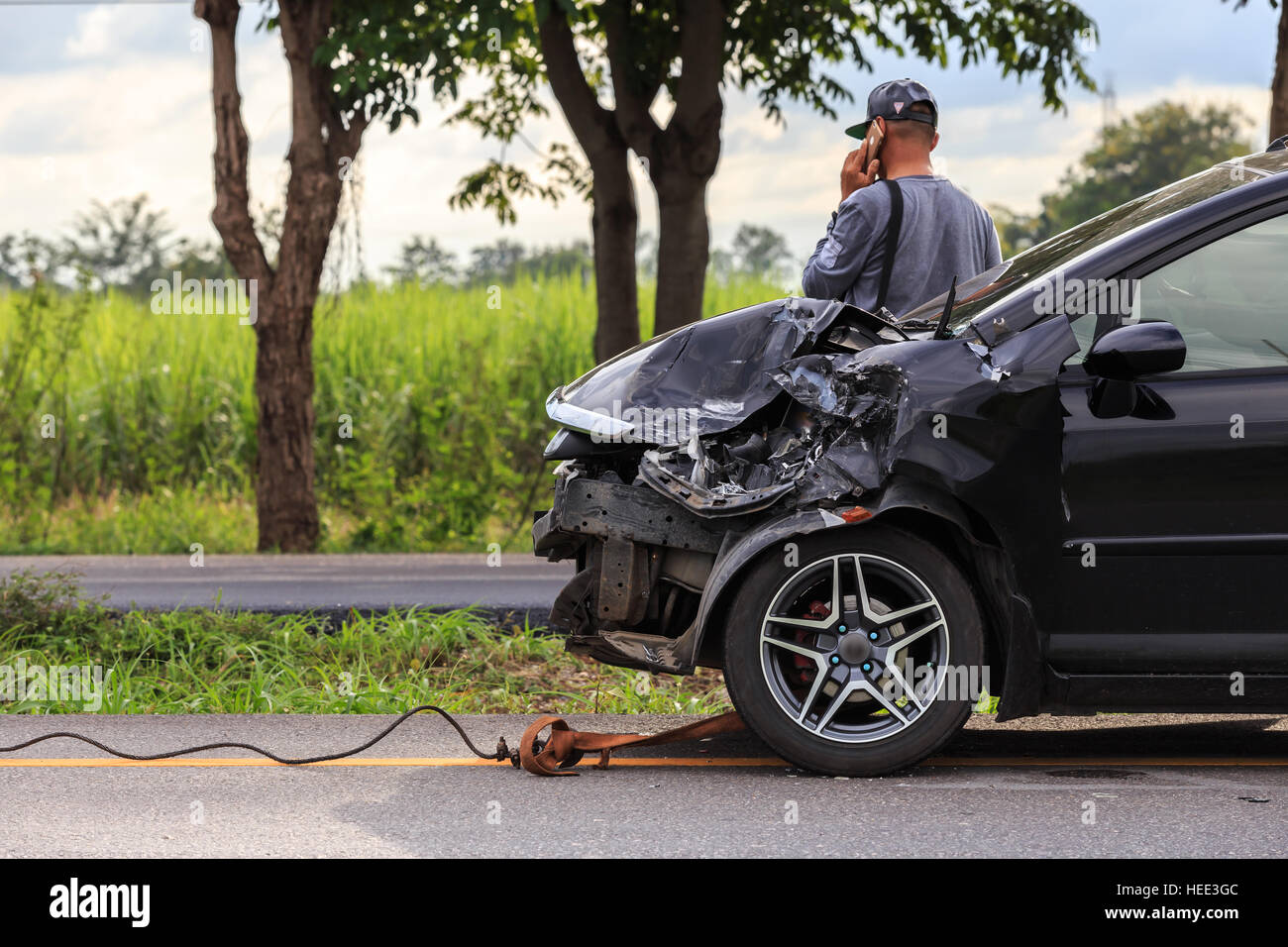 Front of black car get damaged by accident on the road Stock Photo Alamy