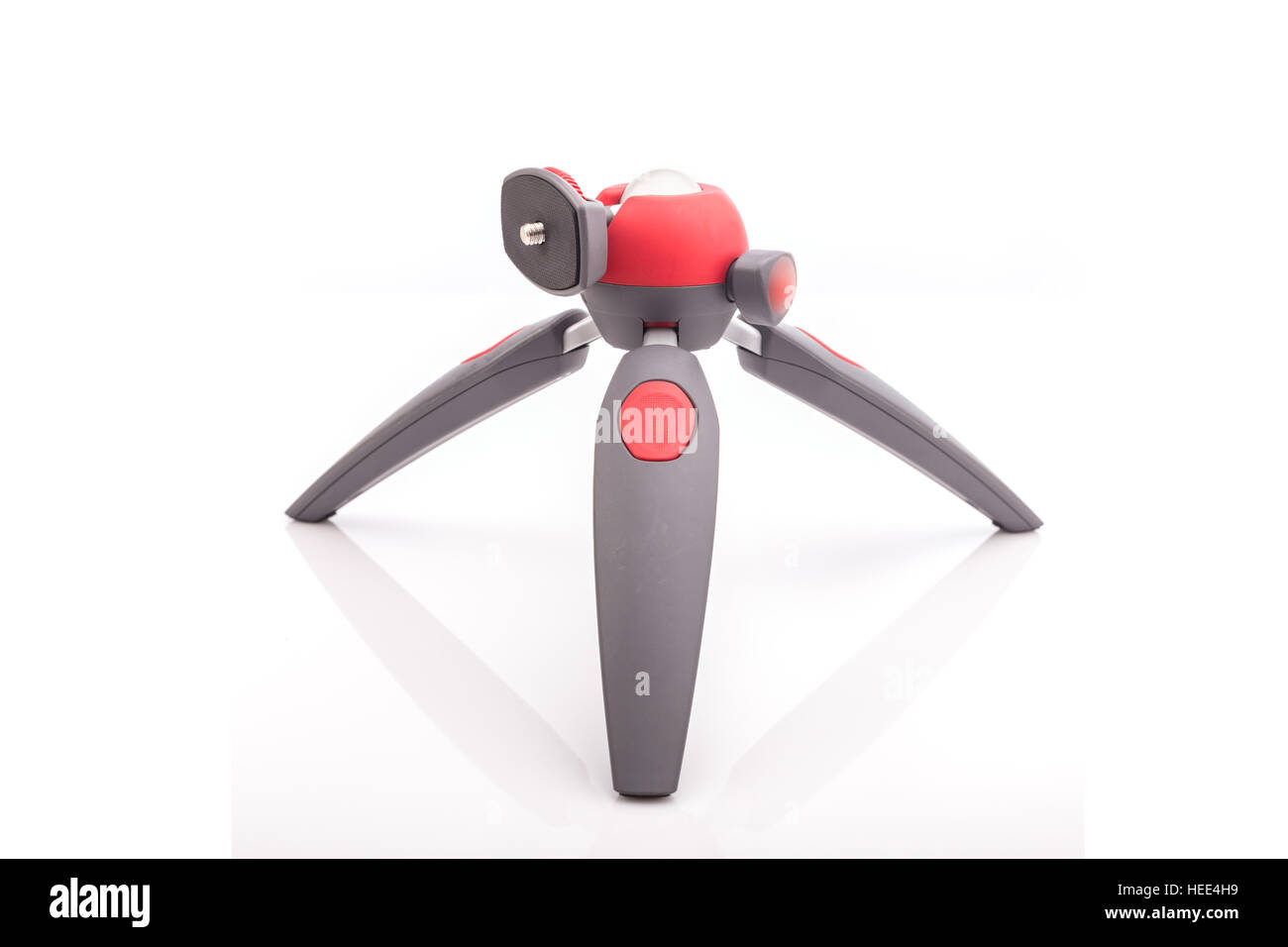 New mini tripod for camera isolated on white background Stock Photo - Alamy