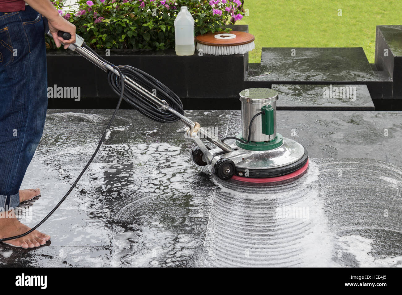Exterior black stone floor cleaning with polishing machine and Stock Photo: 129388733 - Alamy How To Clean Exterior Stone On House