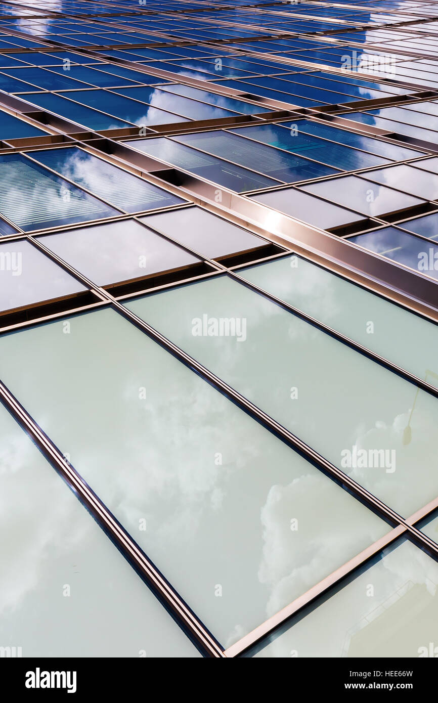glass facade of an office building with reflection of the sky Stock ...