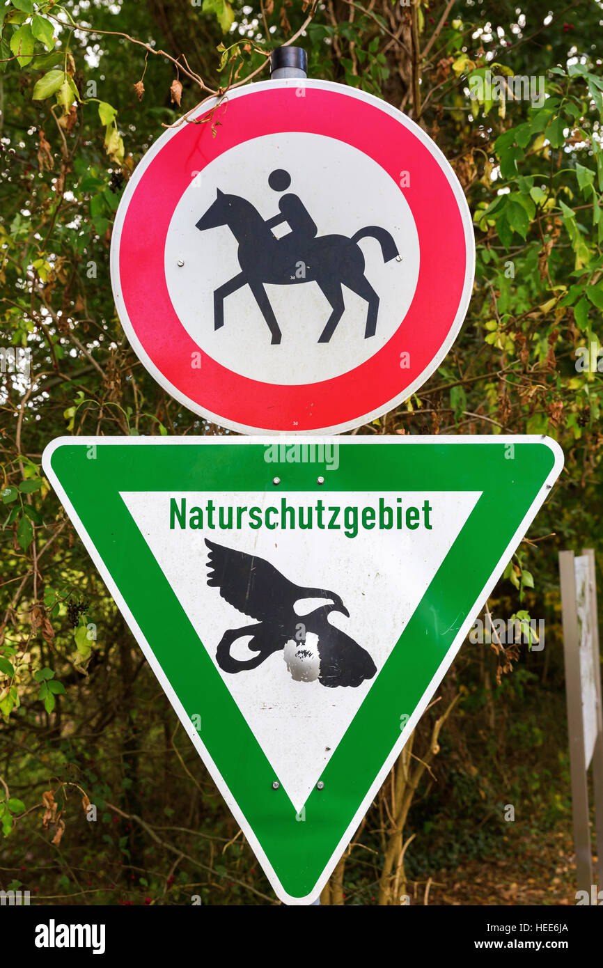 nature reserve sign and sign for riding forbiddance in Germany Stock Photo