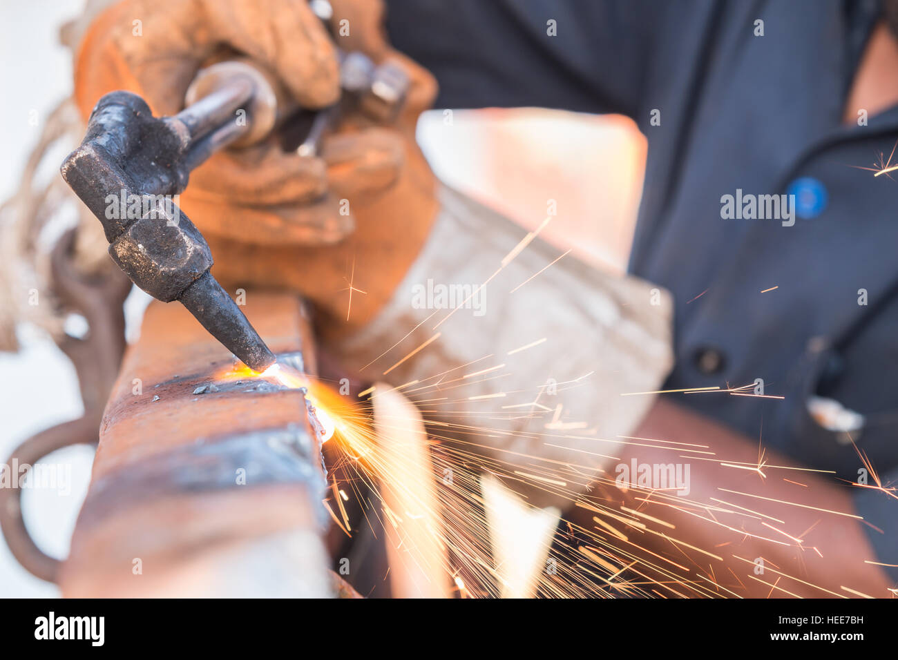 A worker cutting steel using metal torch Stock Photo - Alamy