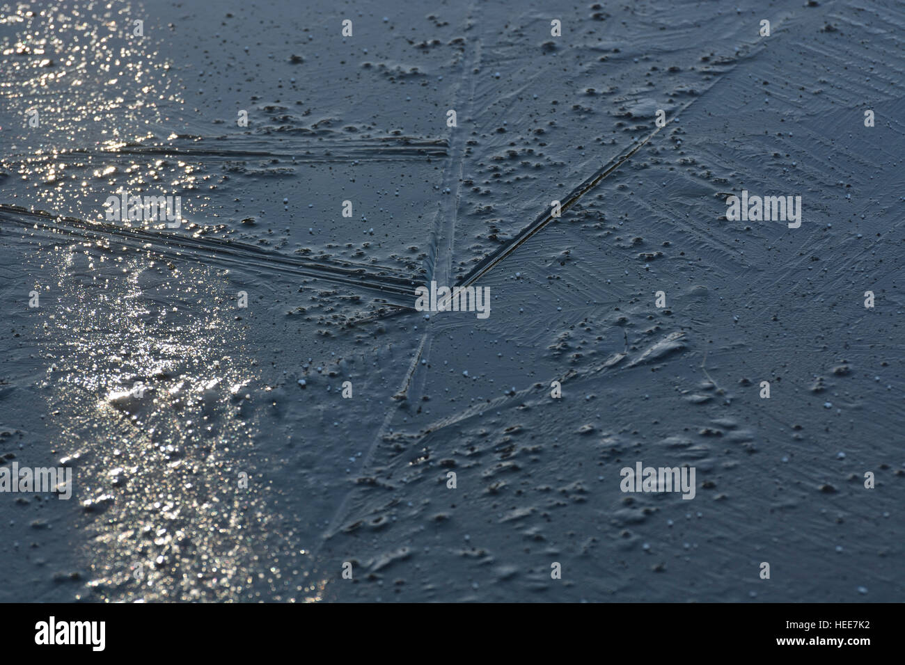 Ice crystals on the surface of the frozen water Stock Photo - Alamy