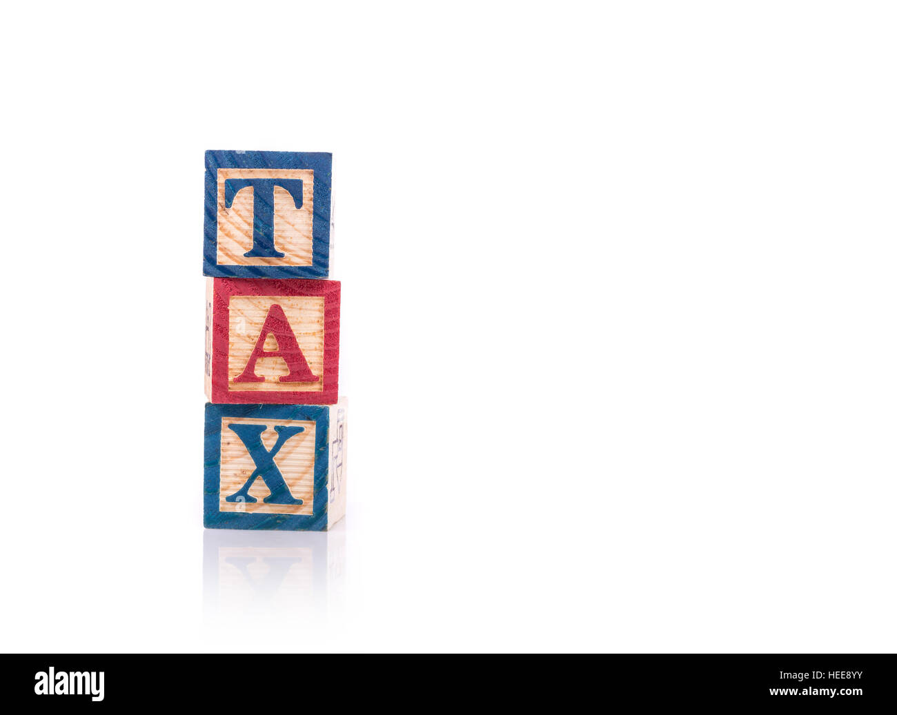 TAX write in colorful wood alphabet blocks isolated on white background Stock Photo