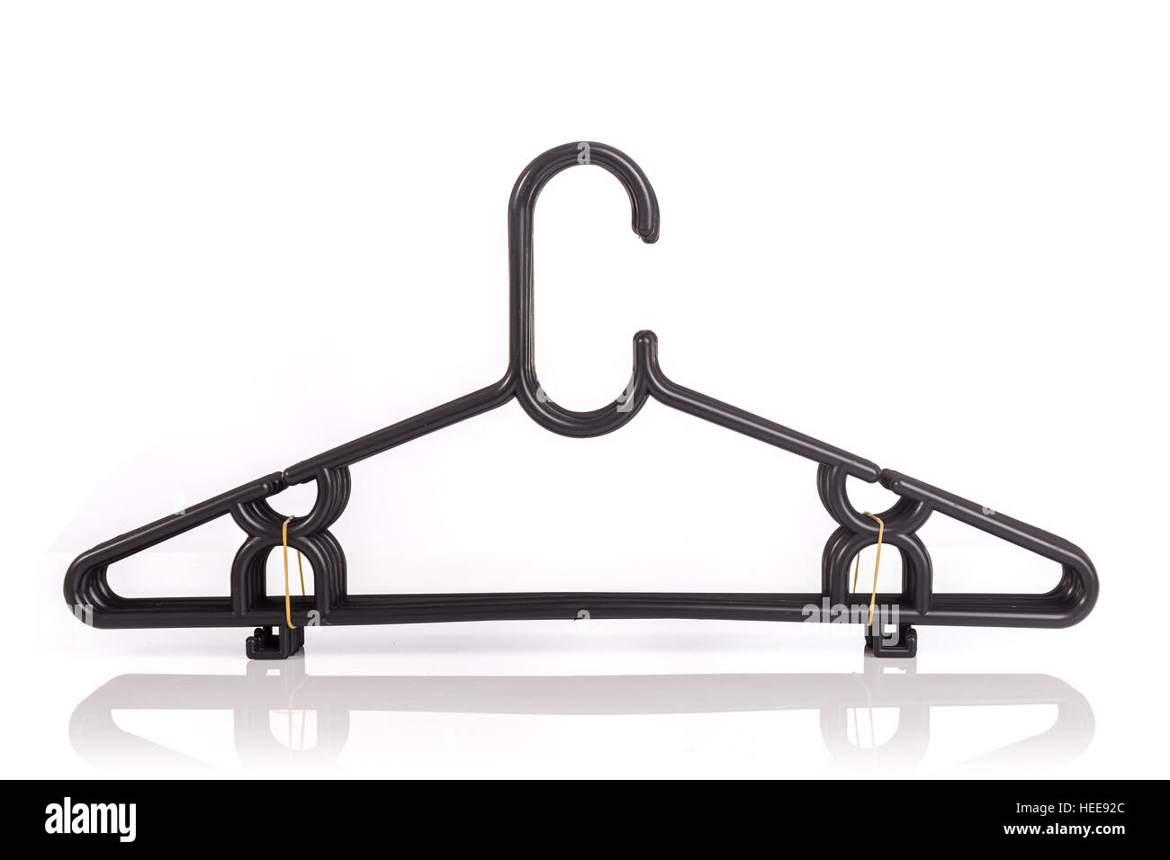 Close up pack of new black clothes hanger isolated on white background Stock Photo