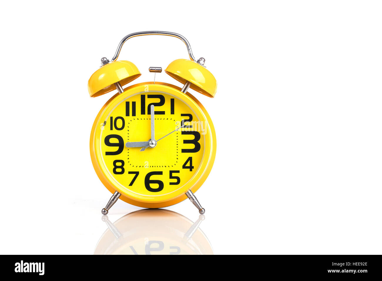 Close up yellow alarm clock isolated on white background Stock Photo ...