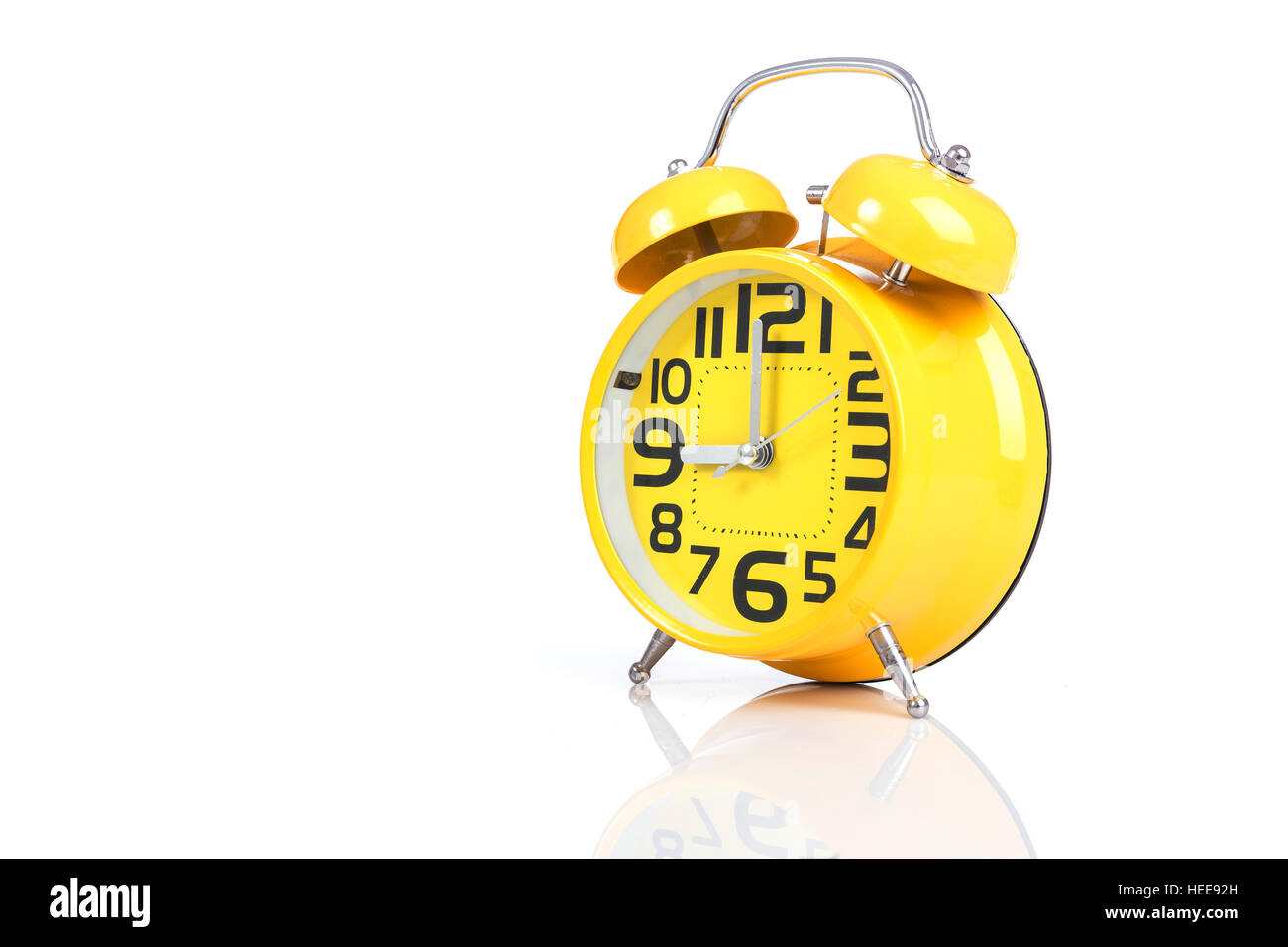 Close up yellow alarm clock isolated on white background Stock Photo ...