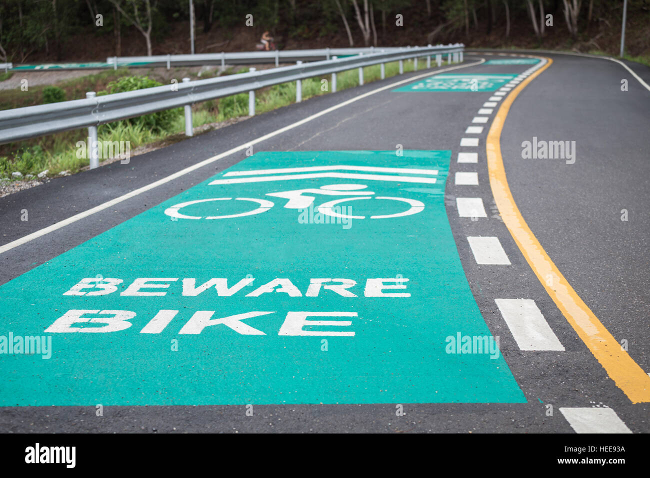 Separated of green bicycle lanes on the asphalt road Stock Photo