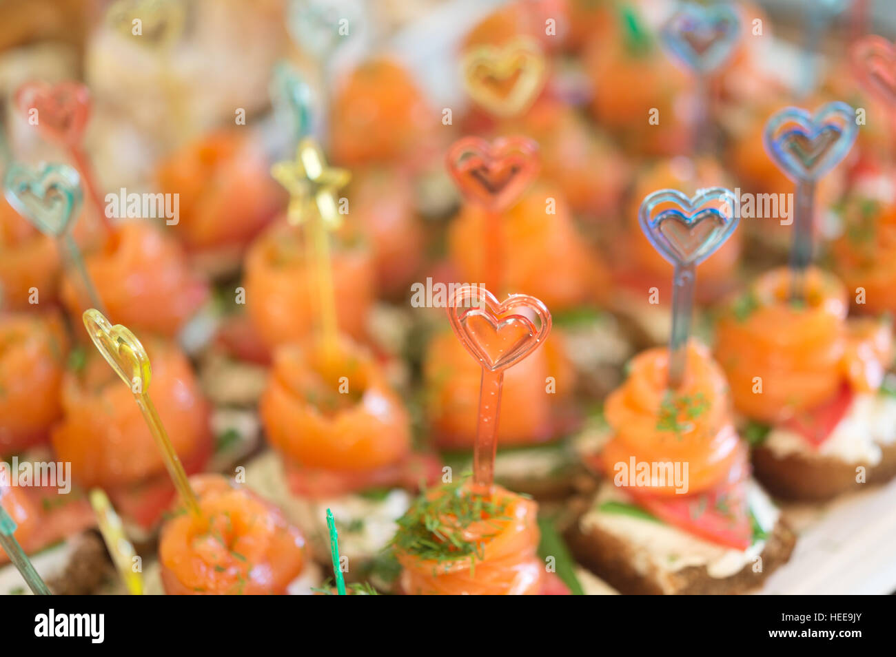 canapes with red fish(focus on sticks) Stock Photo