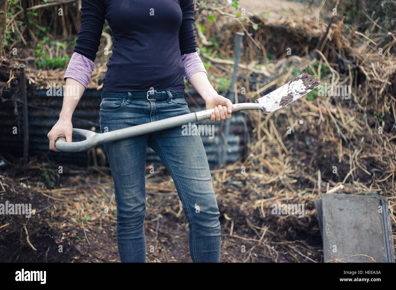 Female gardener digging hole spade hi-res stock photography and images ...