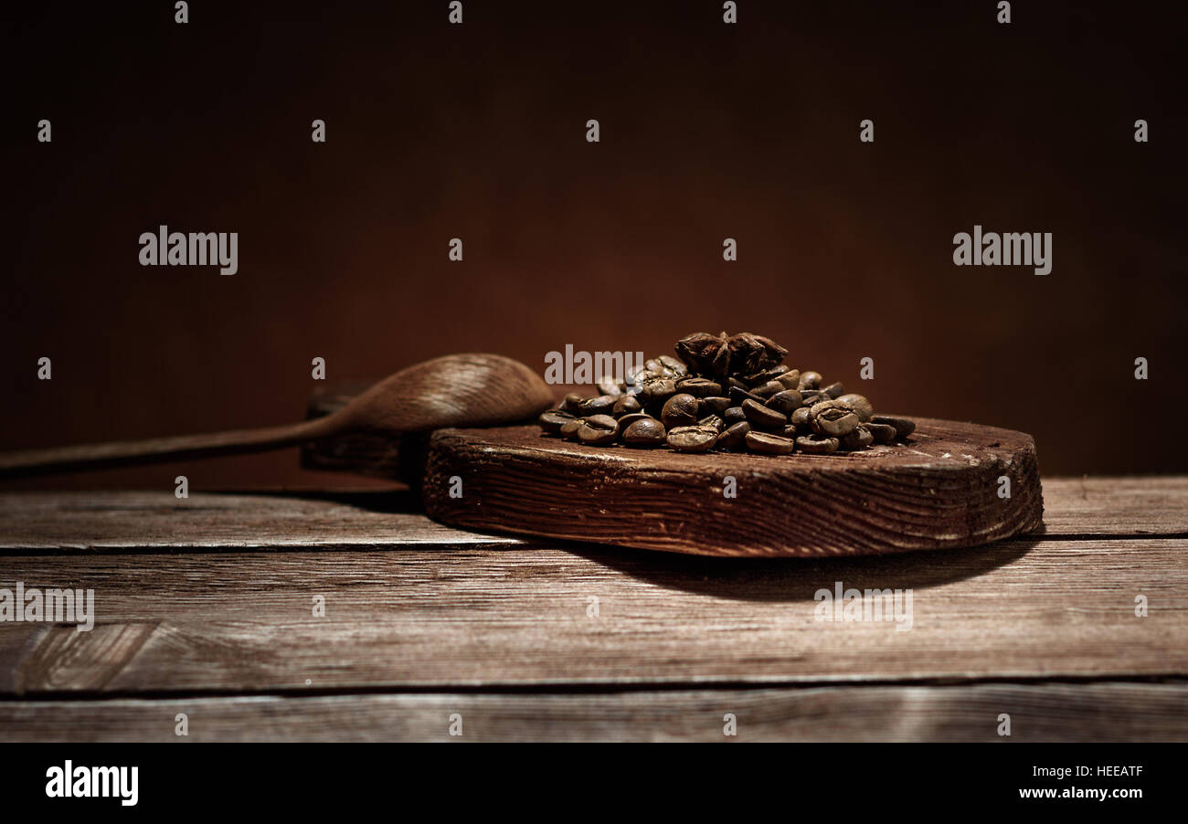 coffee and star anise on a wooden Board on the brown background on magic Christmas holiday Stock Photo