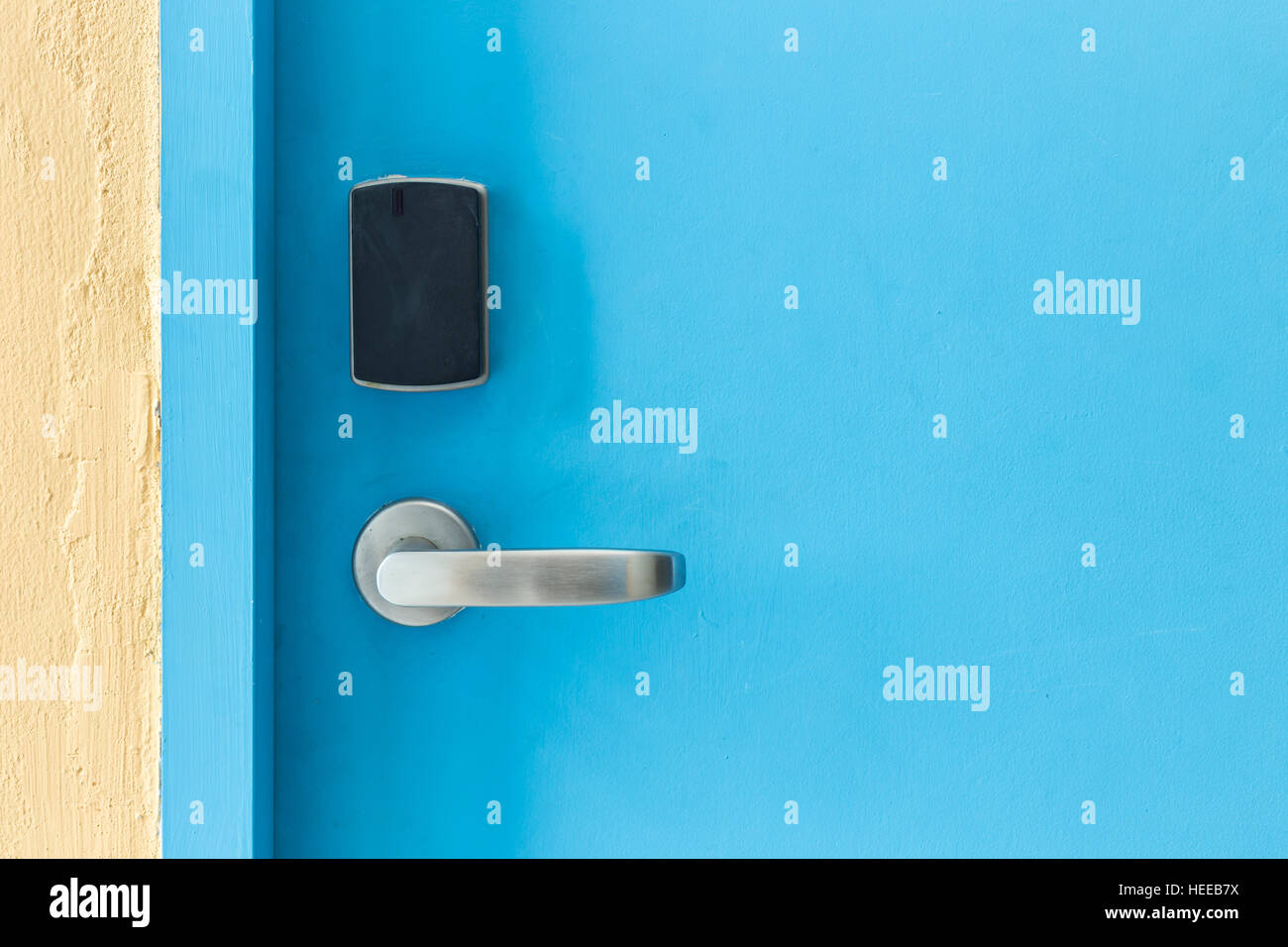 Blue entrance door with electronic keycard lock system Stock Photo Alamy