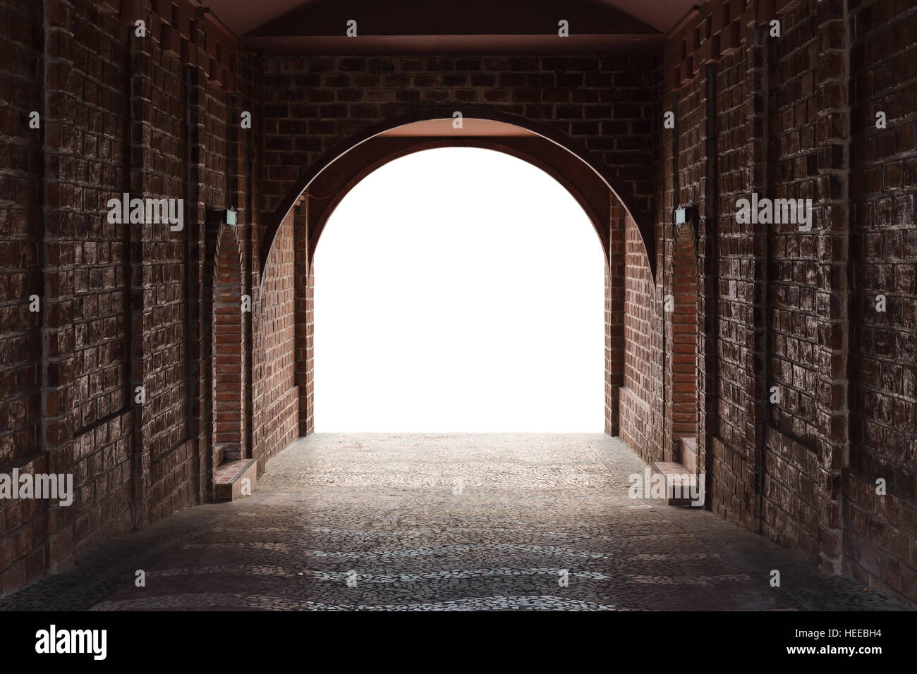 Walkway tunnel made by red brick and middle white isolated space for text or design Stock Photo