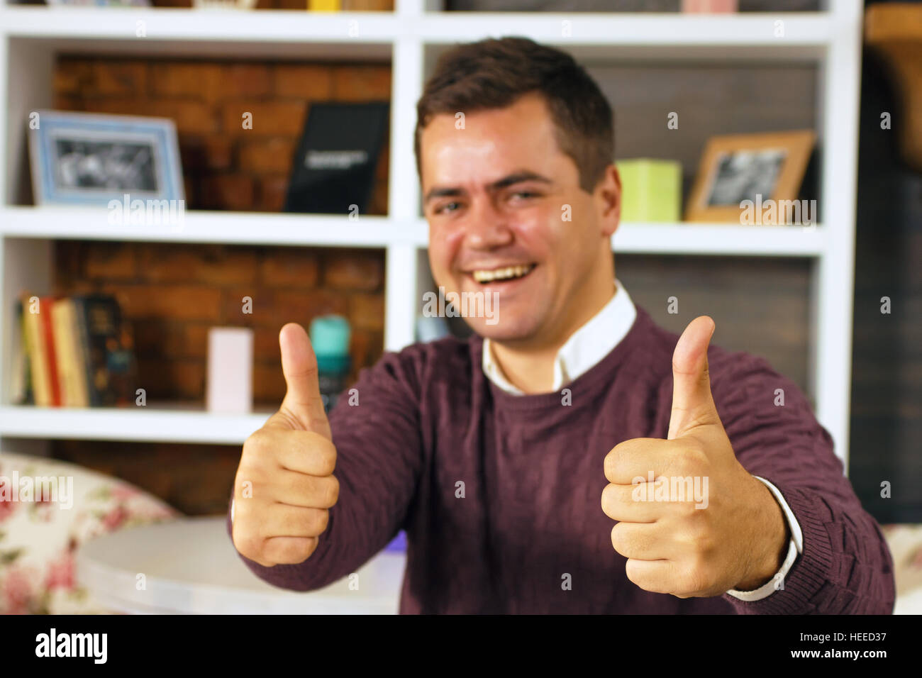 Hand showing two thumbs up hi-res stock photography and images - Alamy