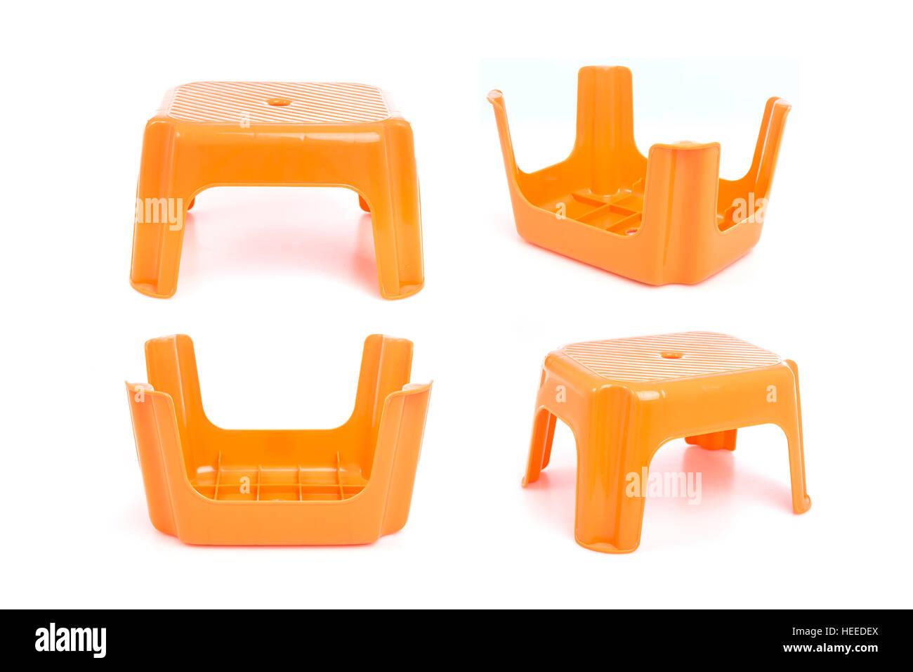 Orange traditional mini four legs plastic chair isolated on white background Stock Photo