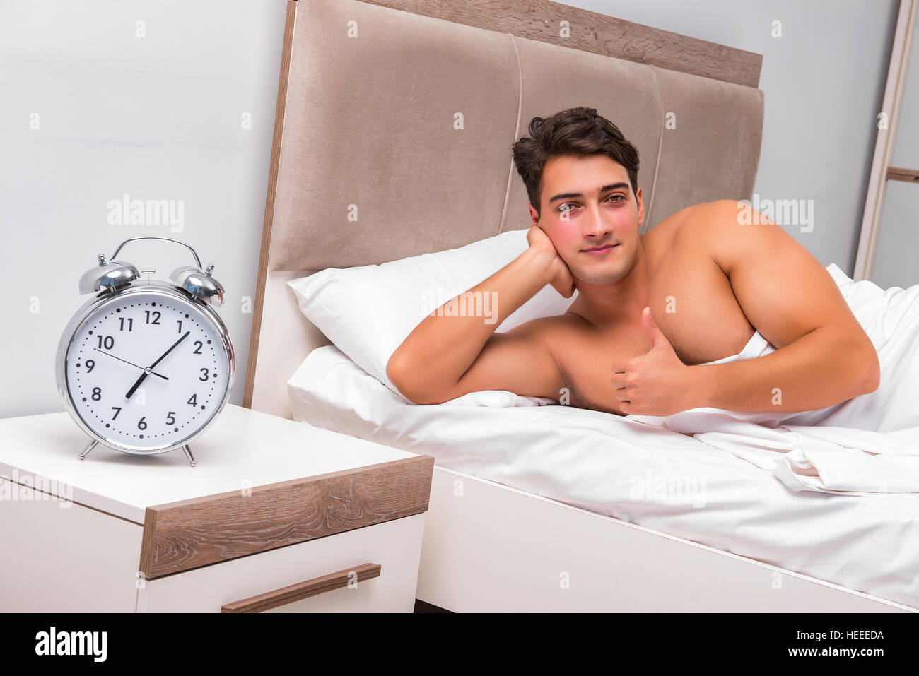 Man having trouble waking up in the morning Stock Photo Alamy