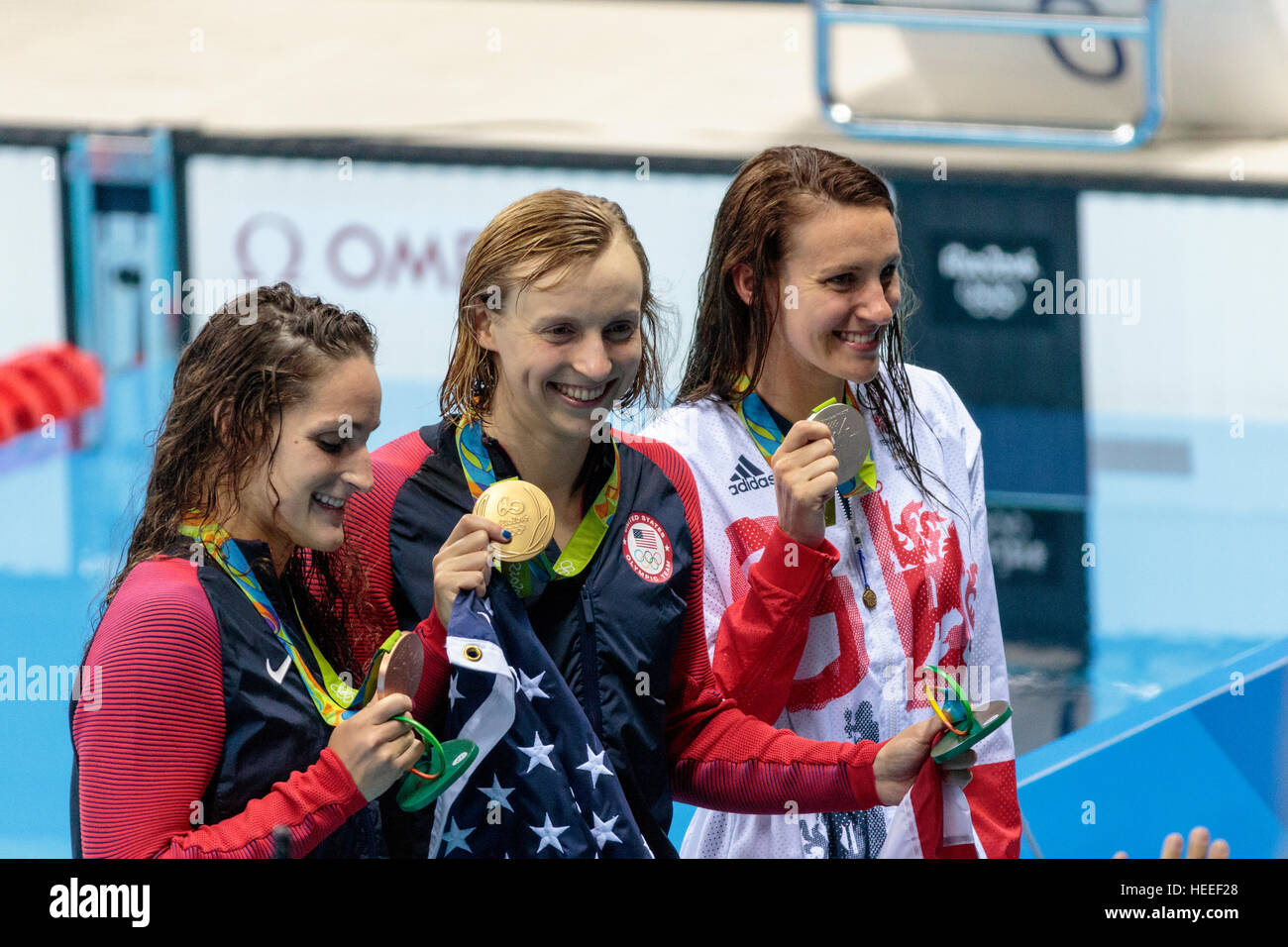 Rio de Janeiro, Brazil. 7 August 2016.   Katie Ledecky (USA) the gold medal winner of the Women's 400m freestyle with Jazz Carlin (GBR)-R-silver and L Stock Photo
