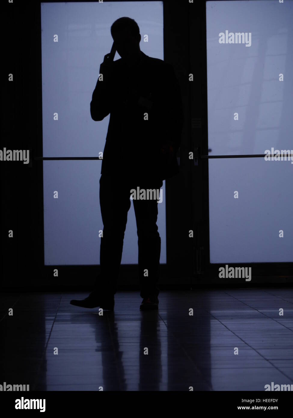 silhouette man phoning Stock Photo