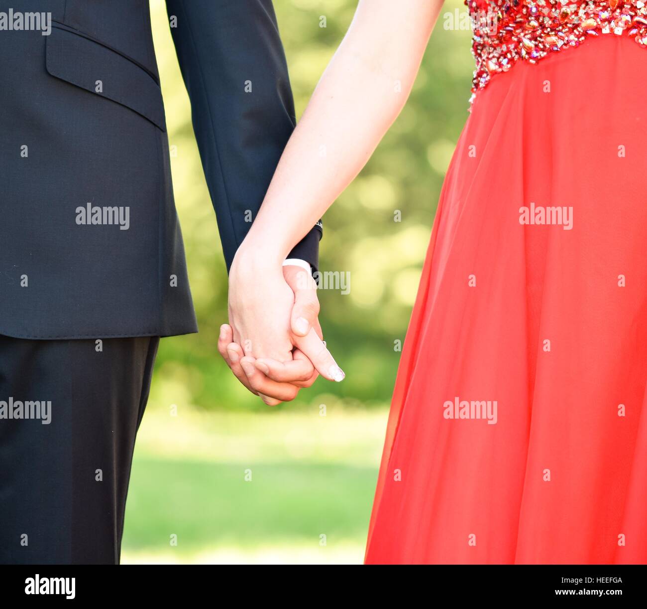 Holding hands couple hi-res stock photography and images - Alamy