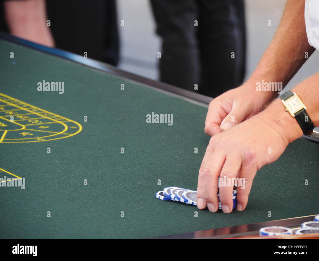 playing with chips at a roulette table Stock Photo - Alamy