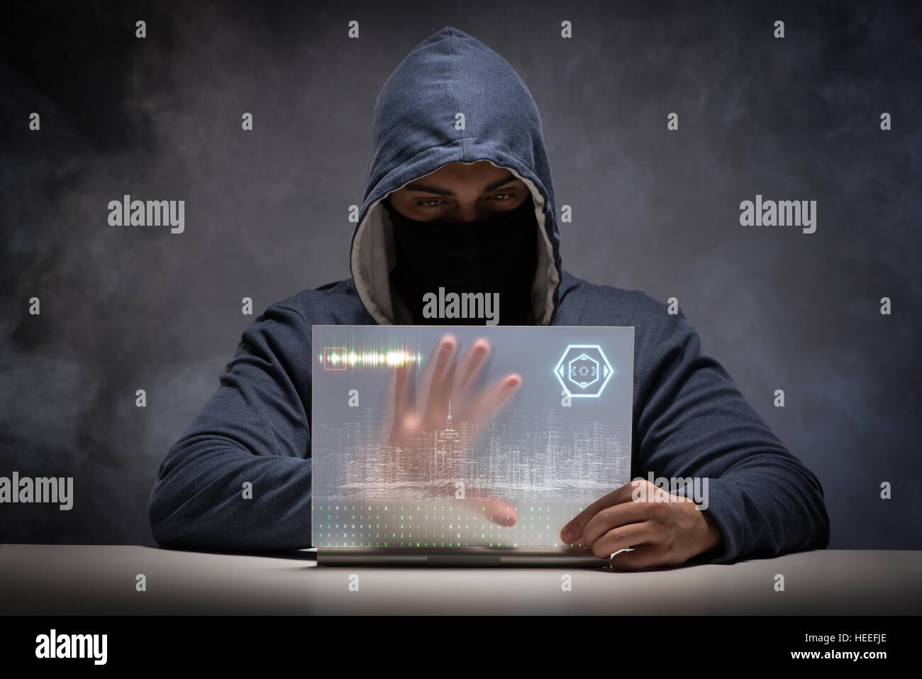 Young hacker in data security concept Stock Photo - Alamy