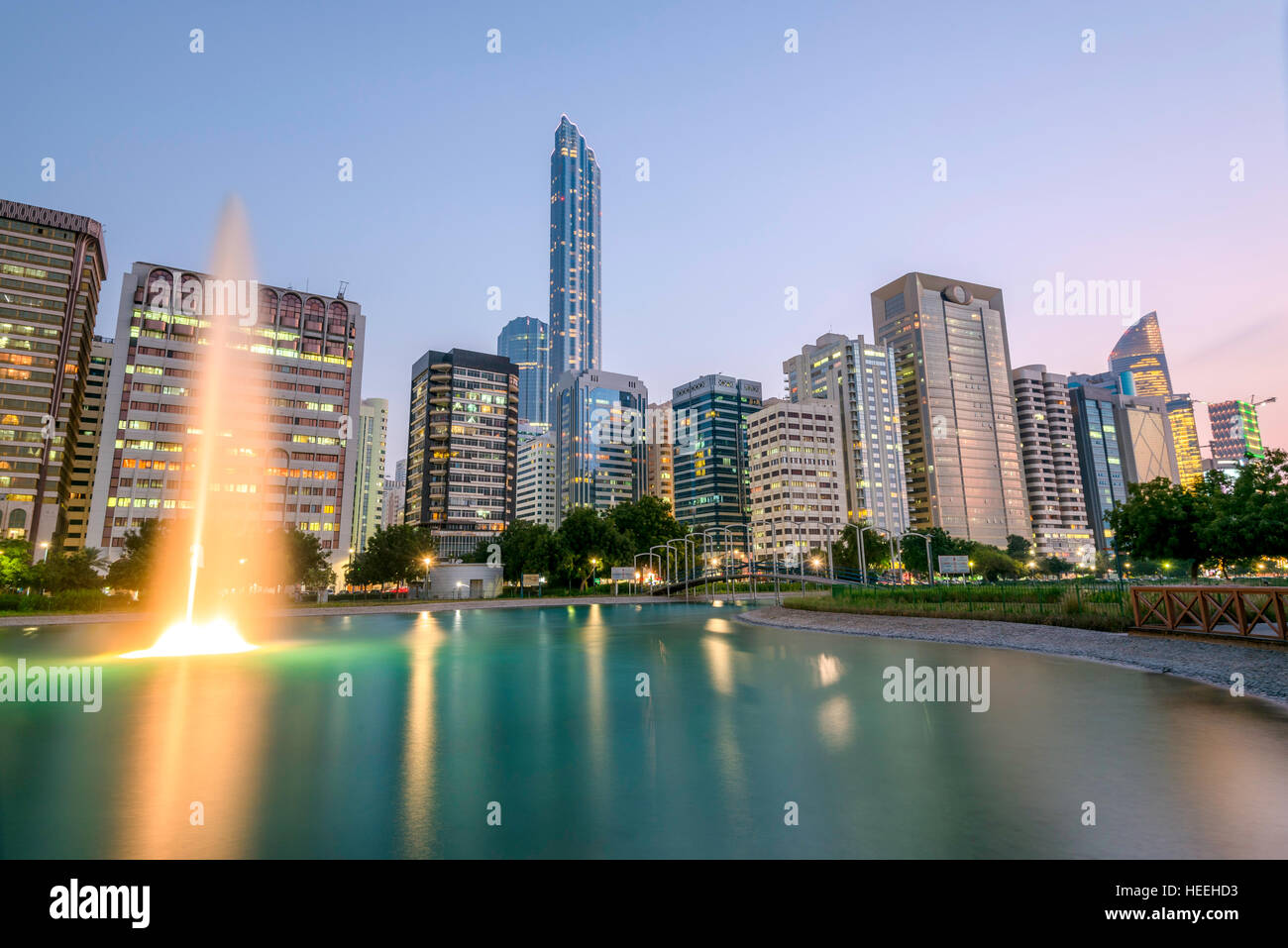 Reflection of buildings on Abu Dhabi Corniche captured at sunset Stock Photo