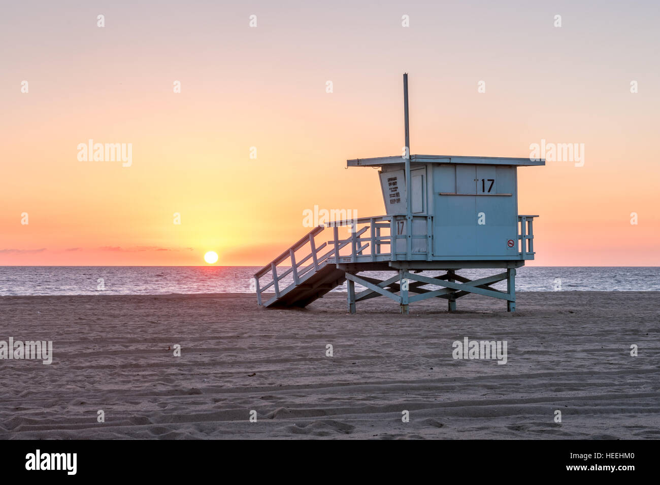 Sunset over a lifeguard hut on Santa Monica beach in California Stock Photo