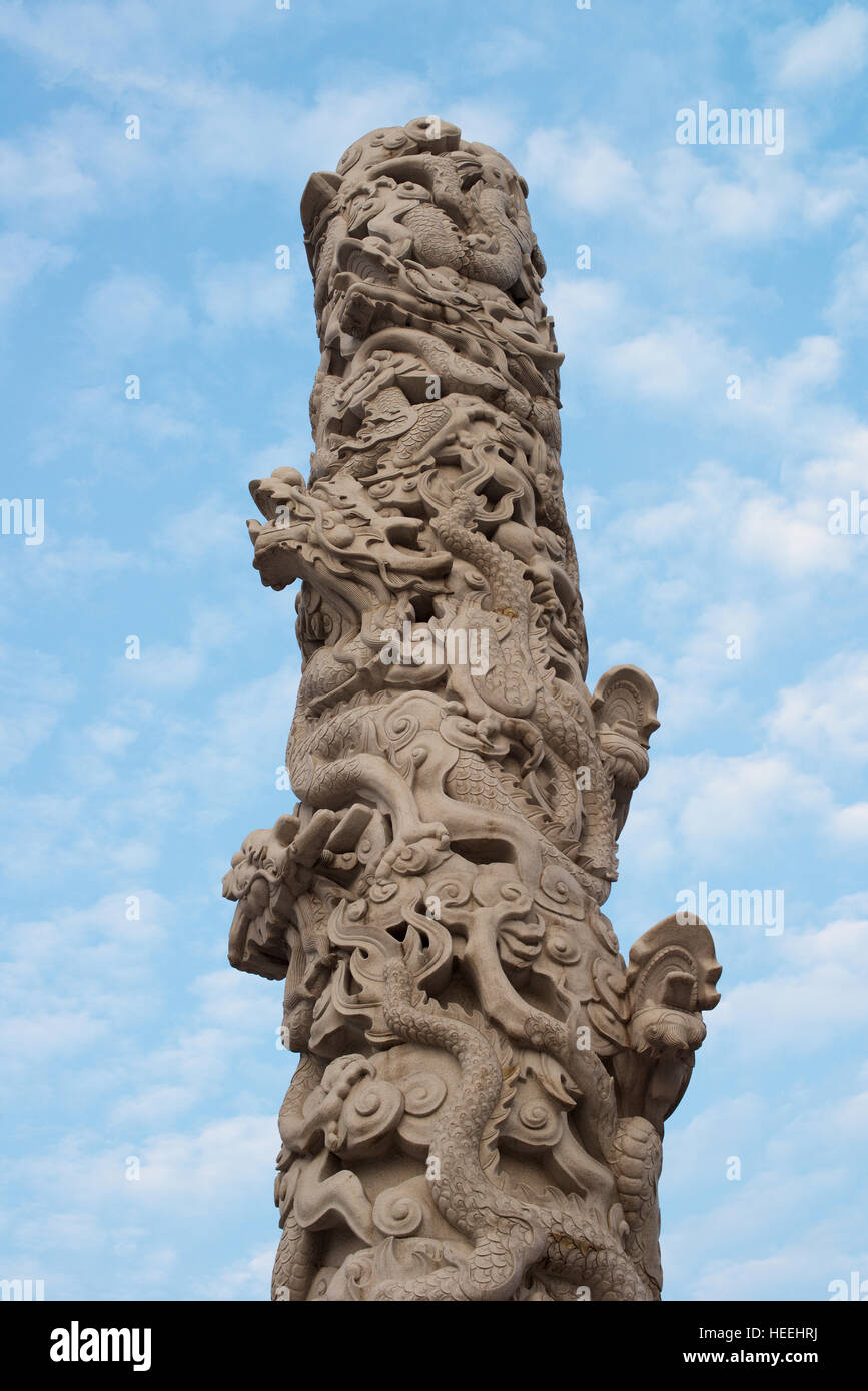 Pillar with dragon ornaments with sky Stock Photo