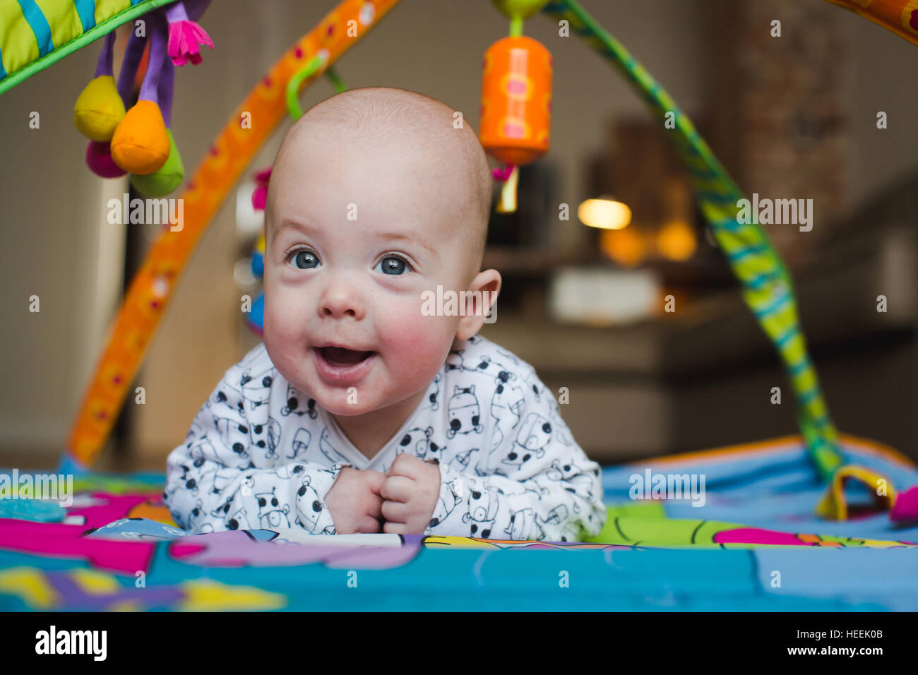 Happy Baby Boy Smiling On Playmat Close Up Stock Photo Alamy