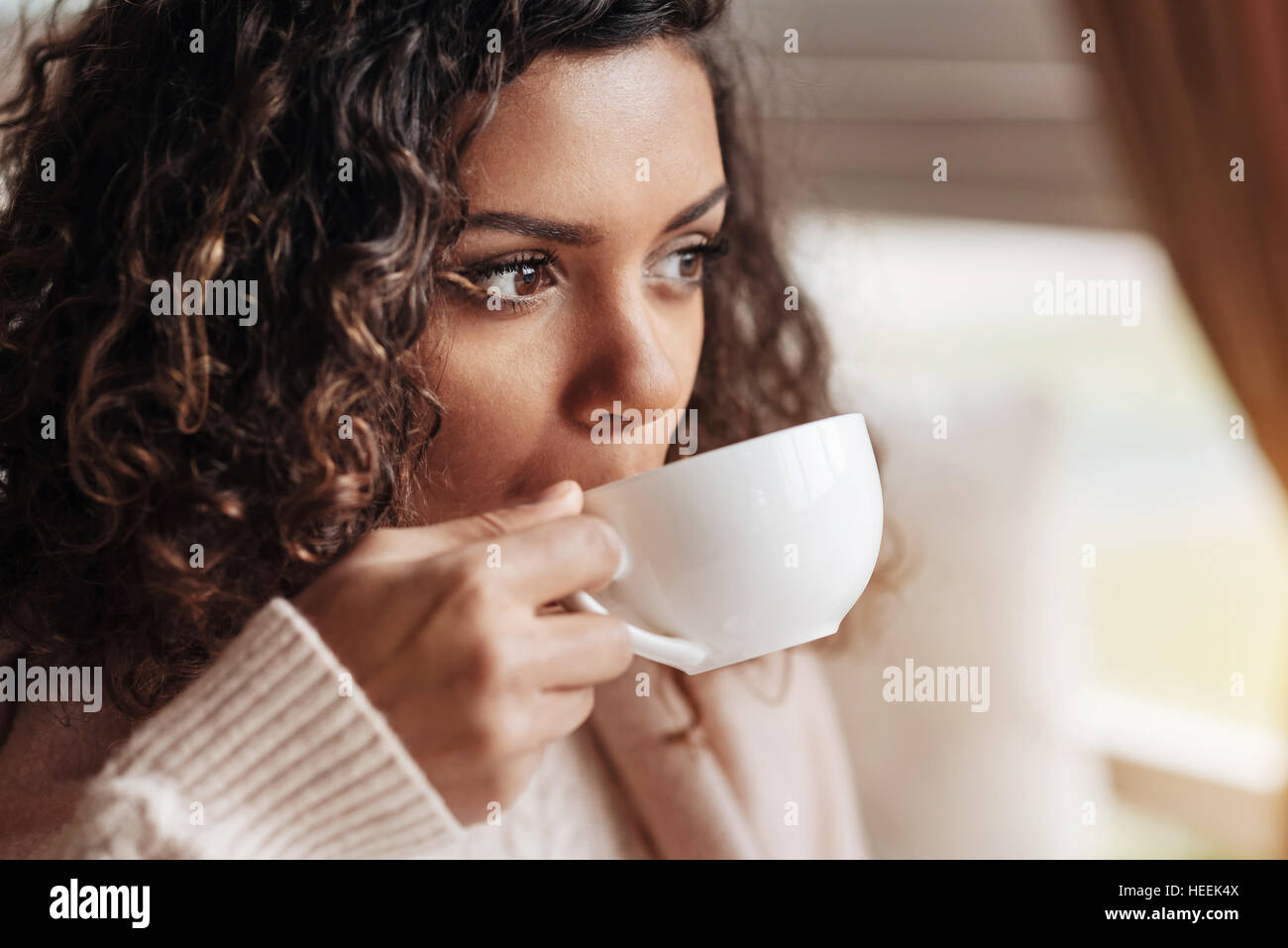 Involved African American woman drinking the cup of tea Stock Photo - Alamy