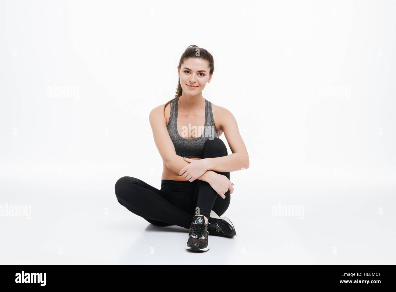 Girl sitting arms legs crossed hi-res stock photography and images - Alamy