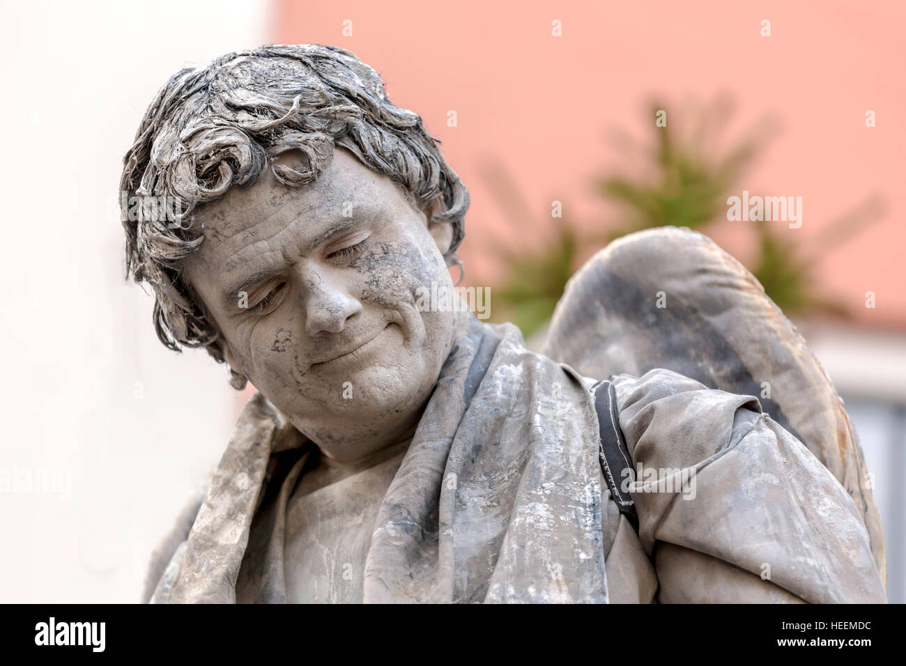 Portrait of an Angel ( a man performing as a living statue ) in a scene  from ''The Little Match Girl'' at the Dickens Festival Stock Photo - Alamy