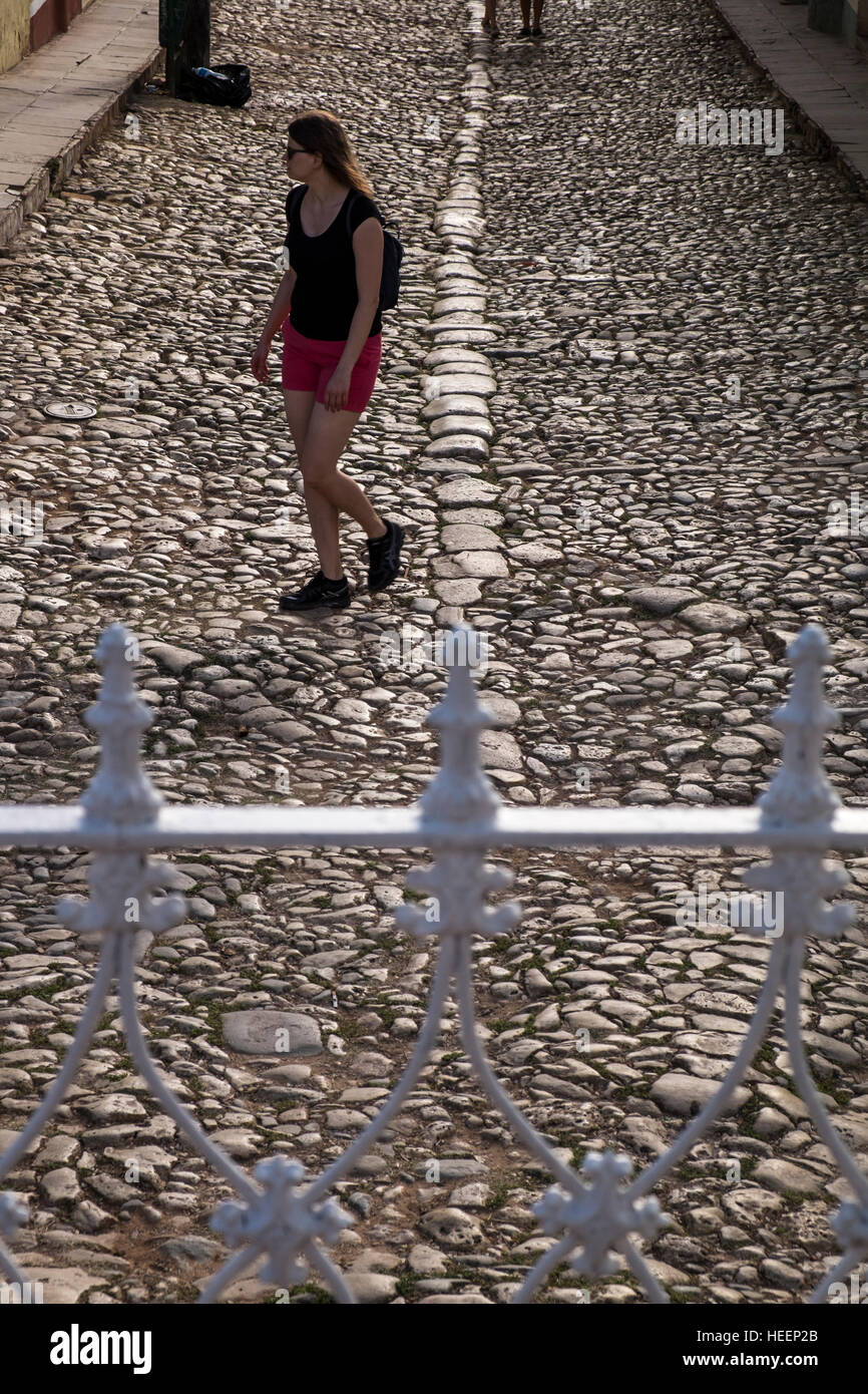 Wrought iron railings and cobblestone street in the Plaza Mayor