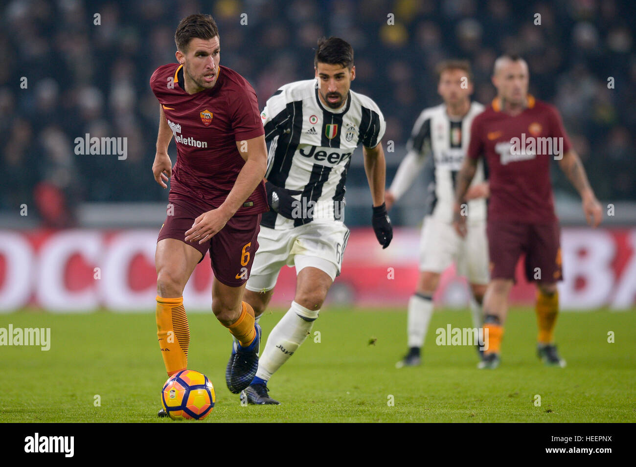 Turin, Italy. 2016, 17 december: Kevin Strootman (left) of AS Roma and Sami Khedira of Juventus FC comepte for the ball during the Serie A football ma Stock Photo