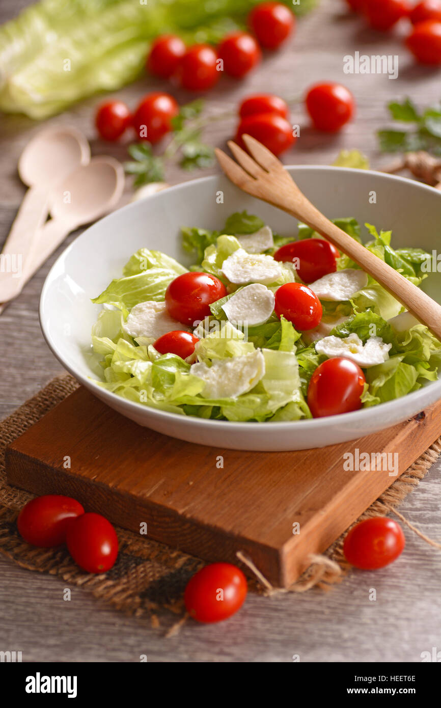 lettuce salad, mozzarella and tomato Traditional Italian recipe Stock Photo Alamy