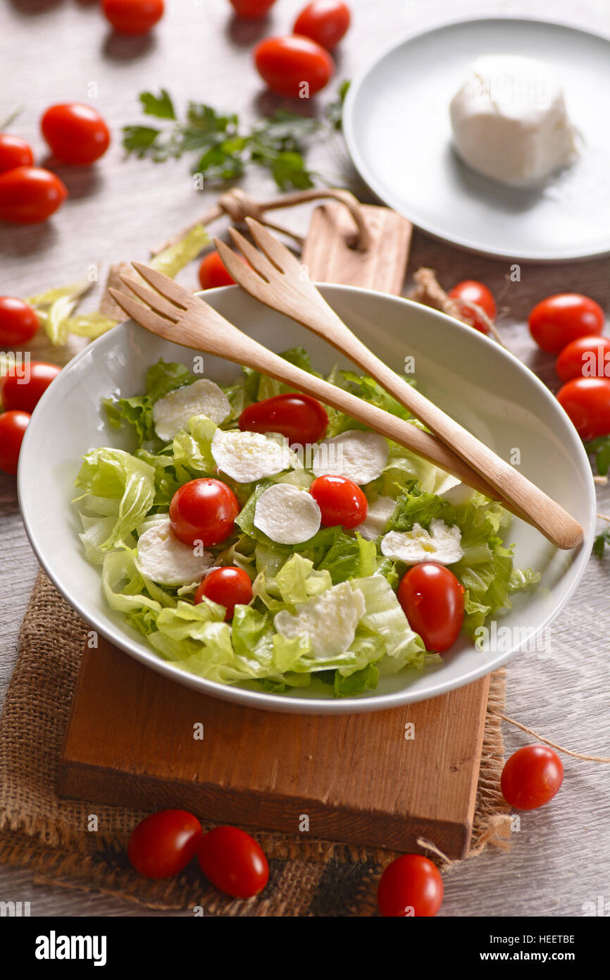 lettuce salad, mozzarella and tomato Traditional Italian recipe Stock