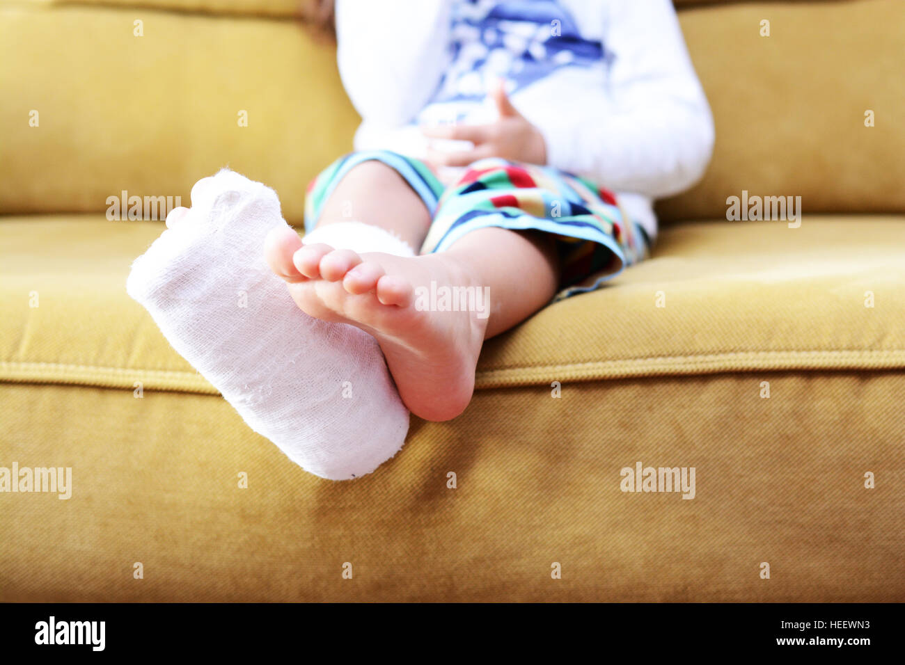 Little child with plaster bandage on leg heel fractured Stock Photo