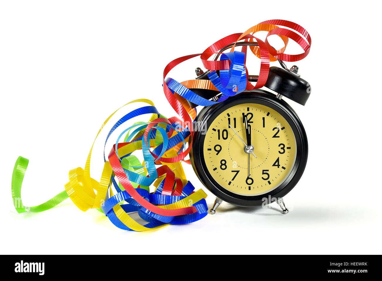 party ribbons on retro New Year's Eve clock isolated on white Stock Photo