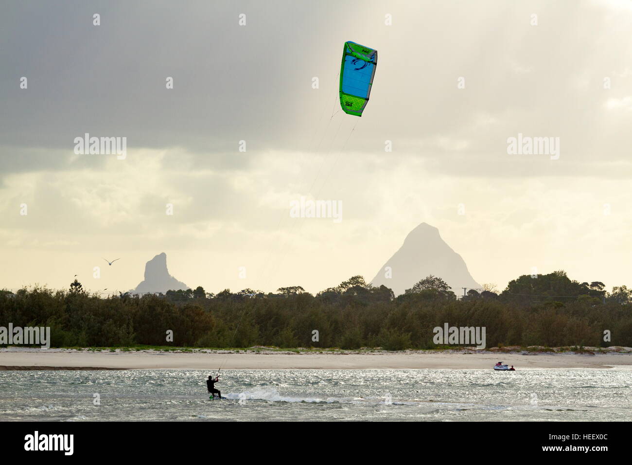 Kite boarders enjoying calm water and a good breeze in Pumicestone Passage, off Happy Valley, Caloundra, Queensland, Australia. Stock Photo