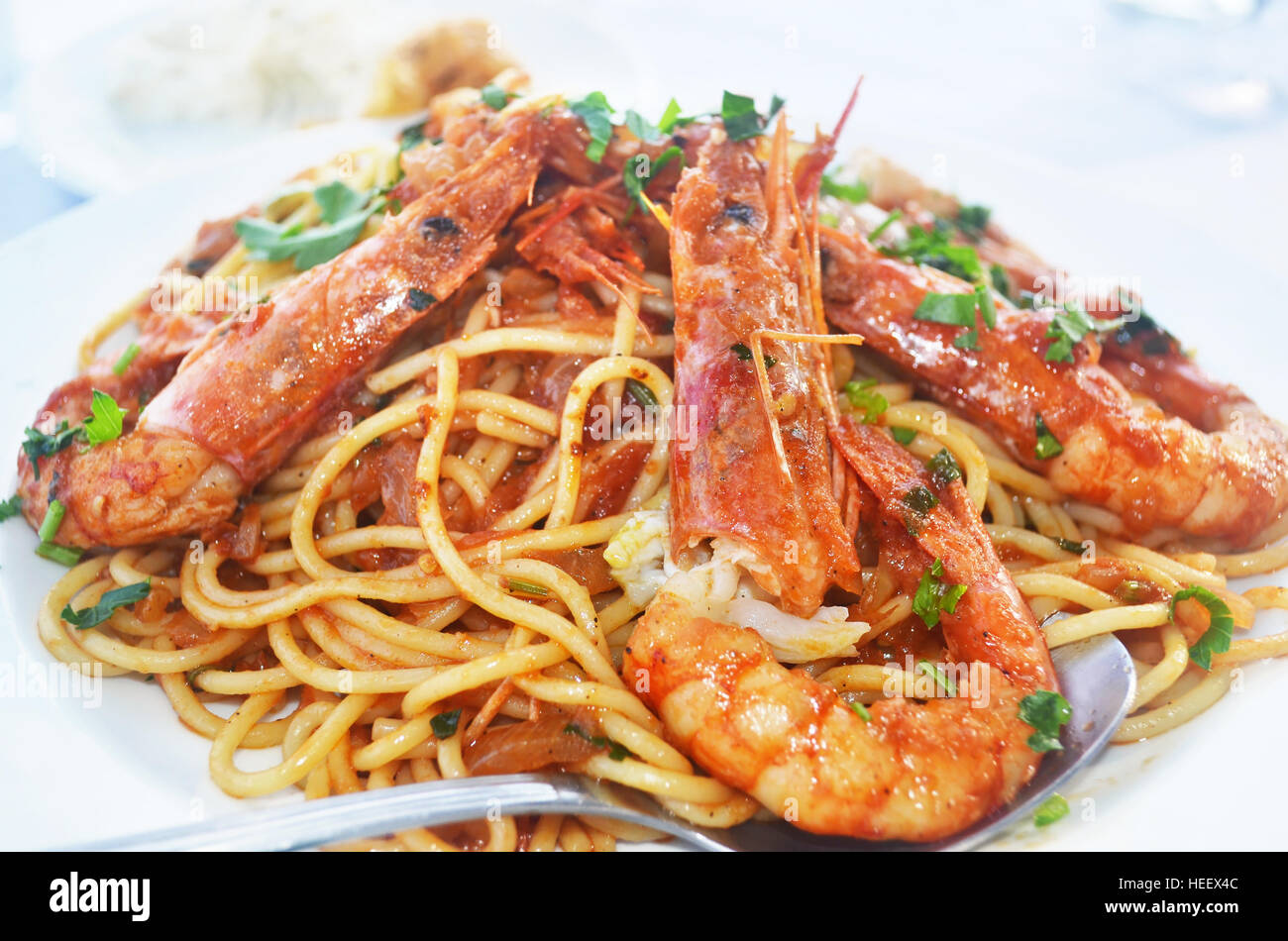 mediterranean seafood - pasta with shrimps at a greek tavern Stock Photo