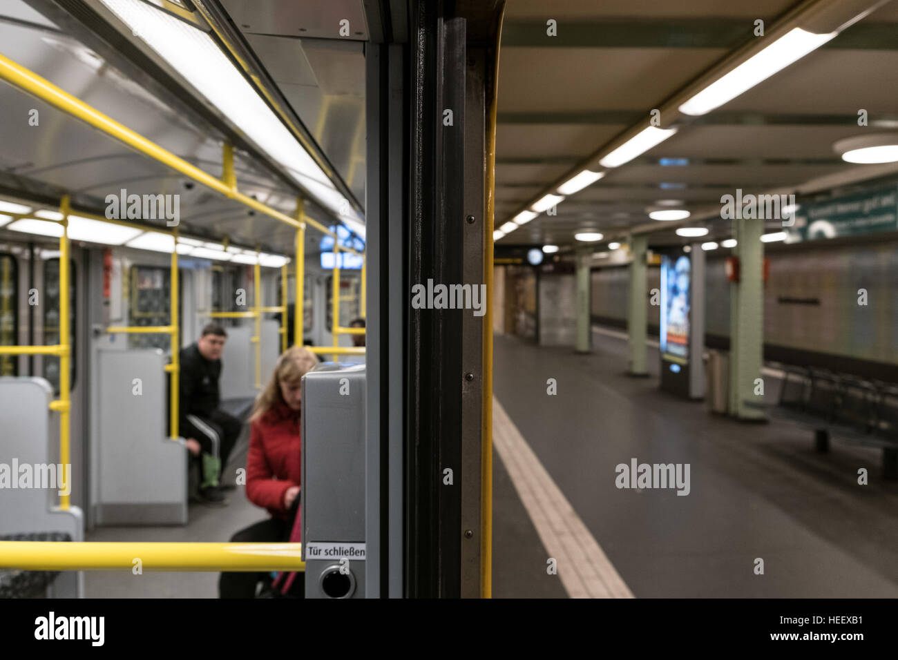 Passengers in subway train (U-Bahn) at metro train station in Berlin, Germany. Stock Photo