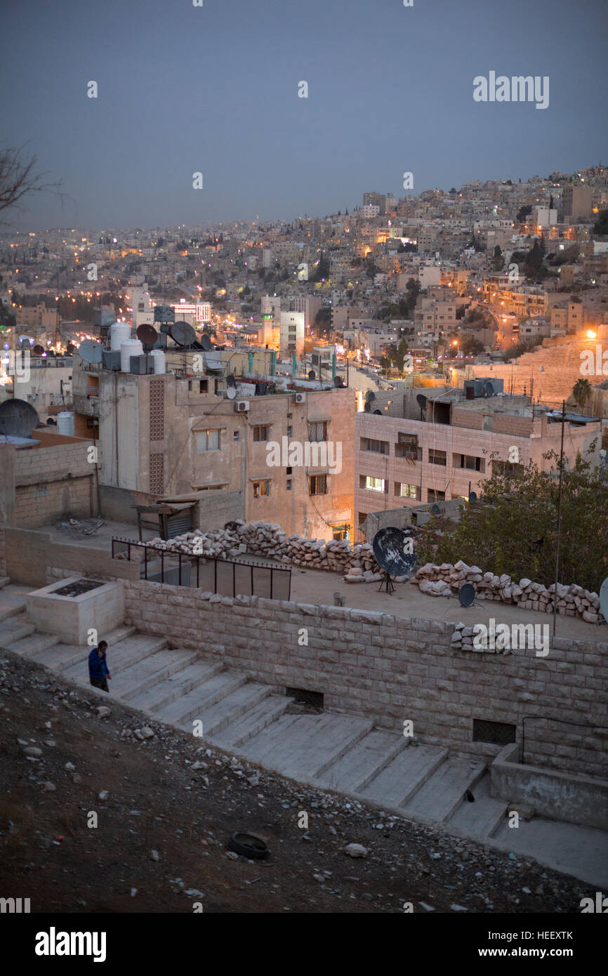 Nighttime street scene in Amman, Jordan showing the ancient Roman amphitheater. Stock Photo