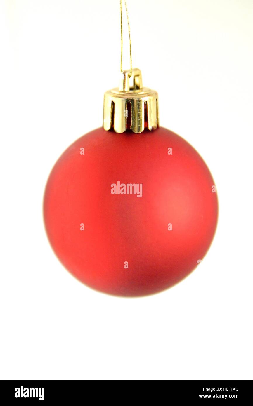 Red Christmas decoration hanging isolated on white Stock Photo