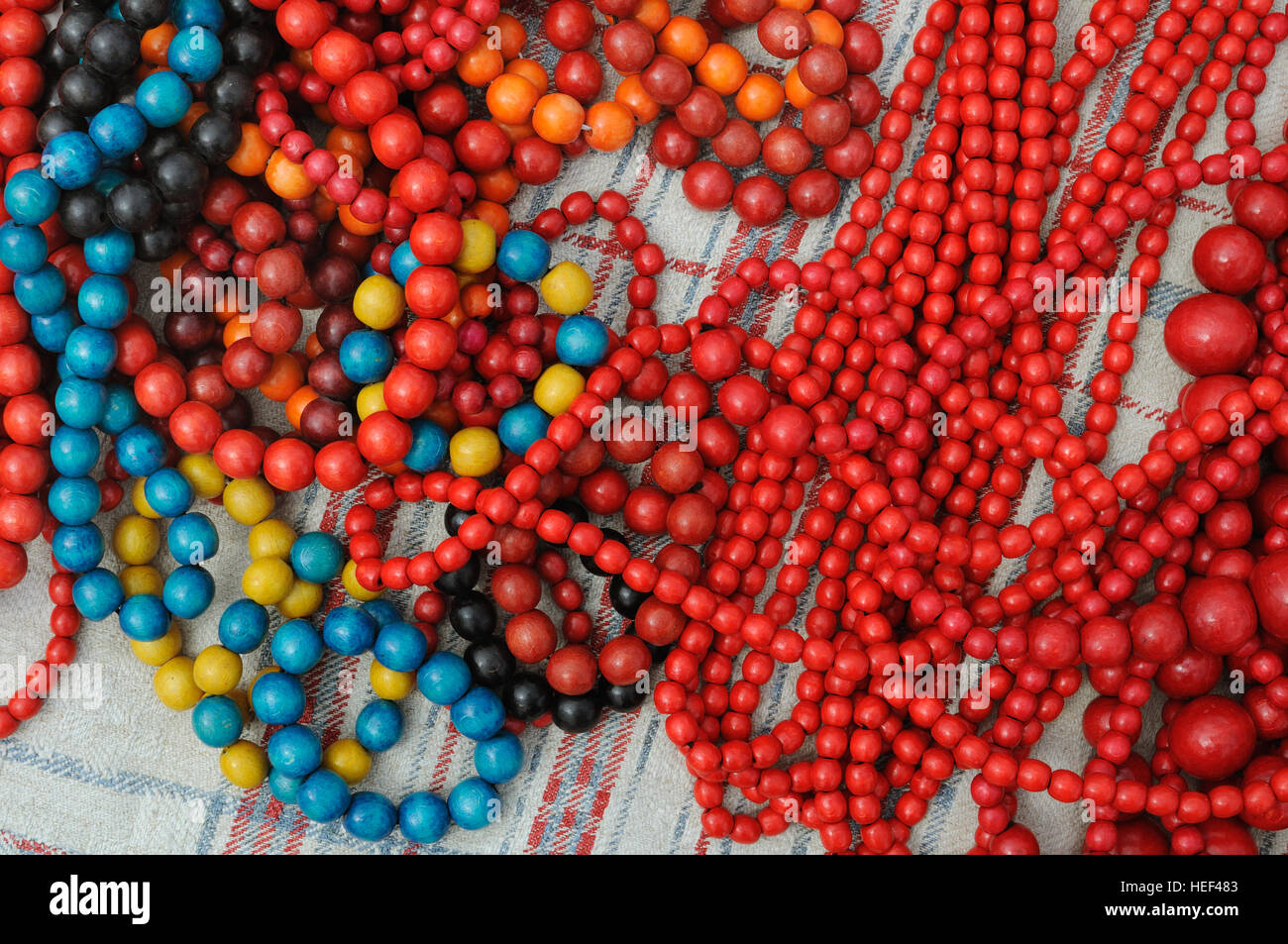 Red Wooden Beads and Bracelet on a Wooden Background Stock Image - Image of  bright, macro: 112335121