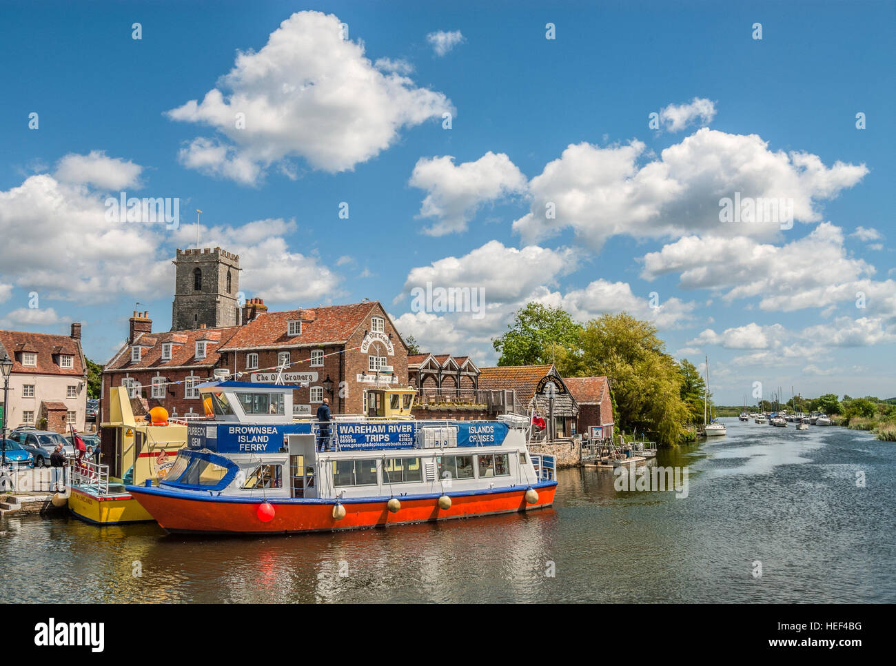 Sightseeing ship and 'The old Canary' Pub at the Wareham Wharf on the River Frome, Dorset, South East England. Stock Photo