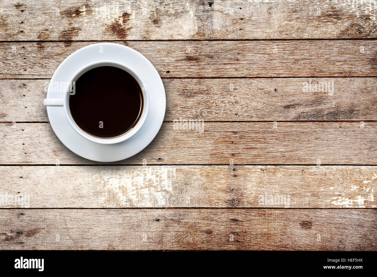 Close up white coffee cup on wooden table top view Stock Photo - Alamy