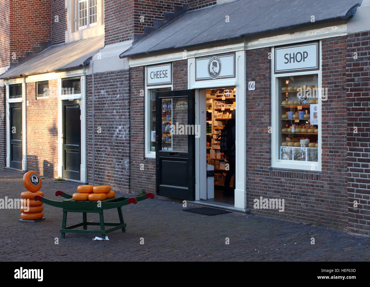 Cheese shop next to 17th century Westerkerk  in  Amsterdam, the Netherlands at Westermarkt in Jordaan Quarter Stock Photo