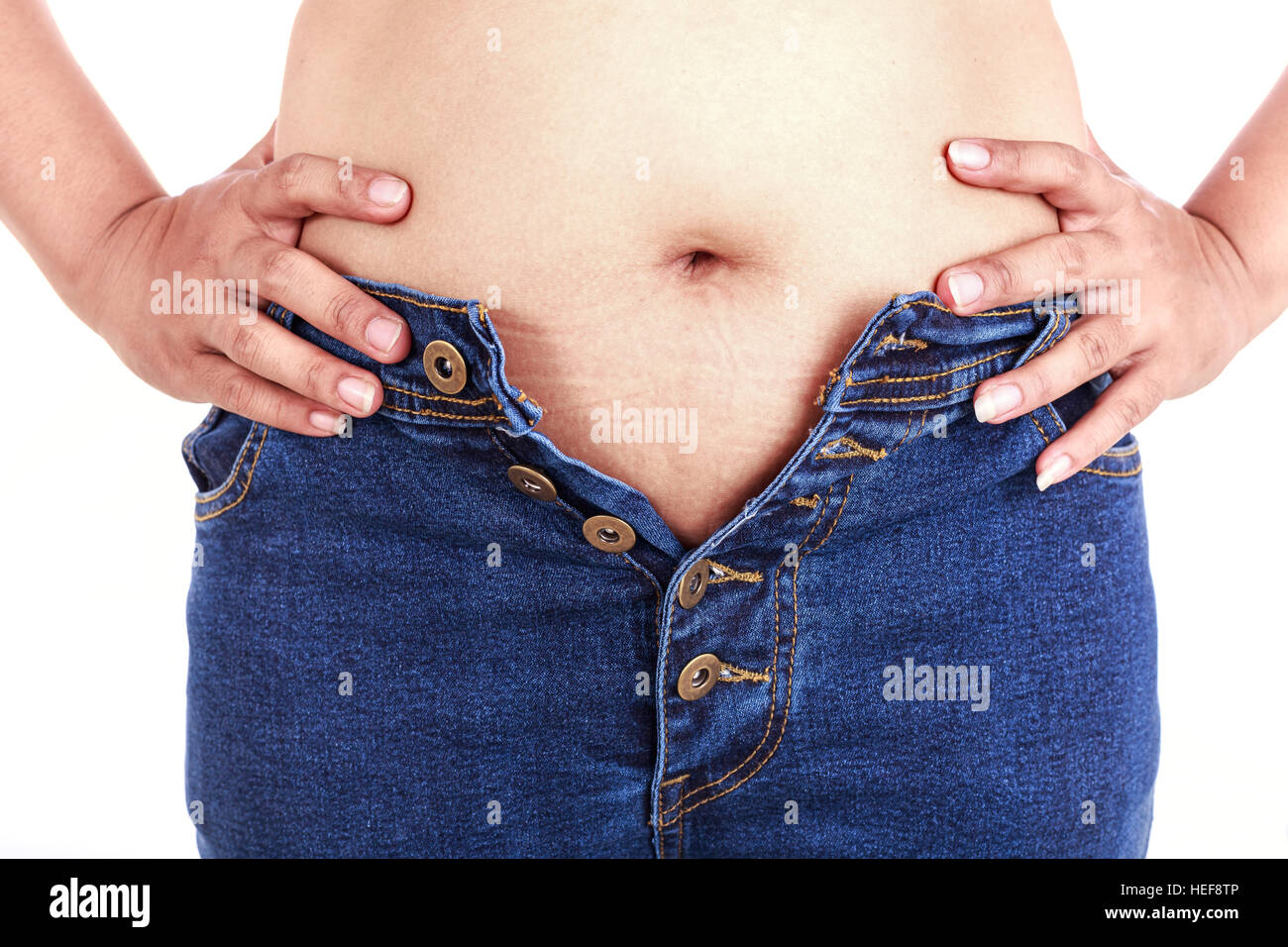 Close up fat woman trying to wear jeans : Fat and Healthy concept Stock  Photo - Alamy